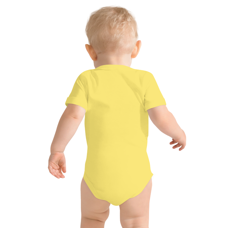 Baby wearing a yellow onesie viewed from the back, on plain background, by Less Hustle, More Joy.