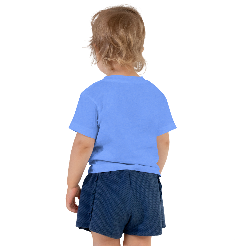 An image of the back of a child wearing a columbia blue t-shirt with white text on the front that reads 'Auntie's Bestie. By Less Hustle, More Joy.