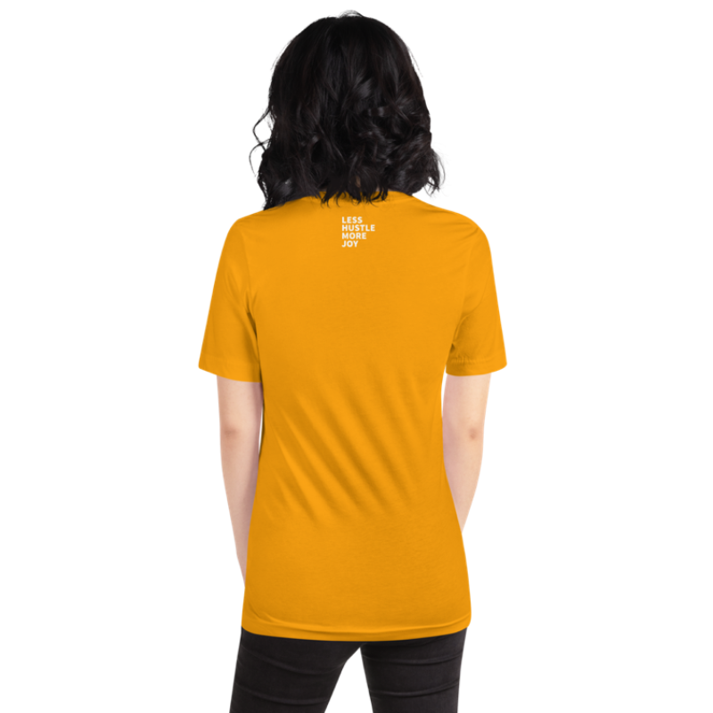 A person shown from the back wearing a gold crew neck t-shirt by Less Hustle, More Joy with the phrase 'In My Sunshine Era' printed in white text on the front. The words Less Hustle More Joy are printed in small white text on the back.