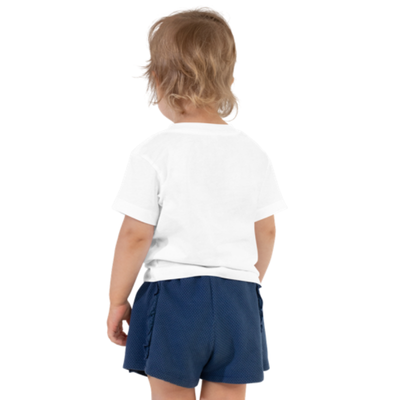 Back view of a white, short-sleeved toddler tee by Less Hustle, More Joy. The front features the word 'Strong' printed in punk rock pink text.