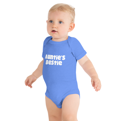 Baby wearing a columbia blue heather onesie with white 'Auntie's Bestie' text, on plain background, by Less Hustle, More Joy.