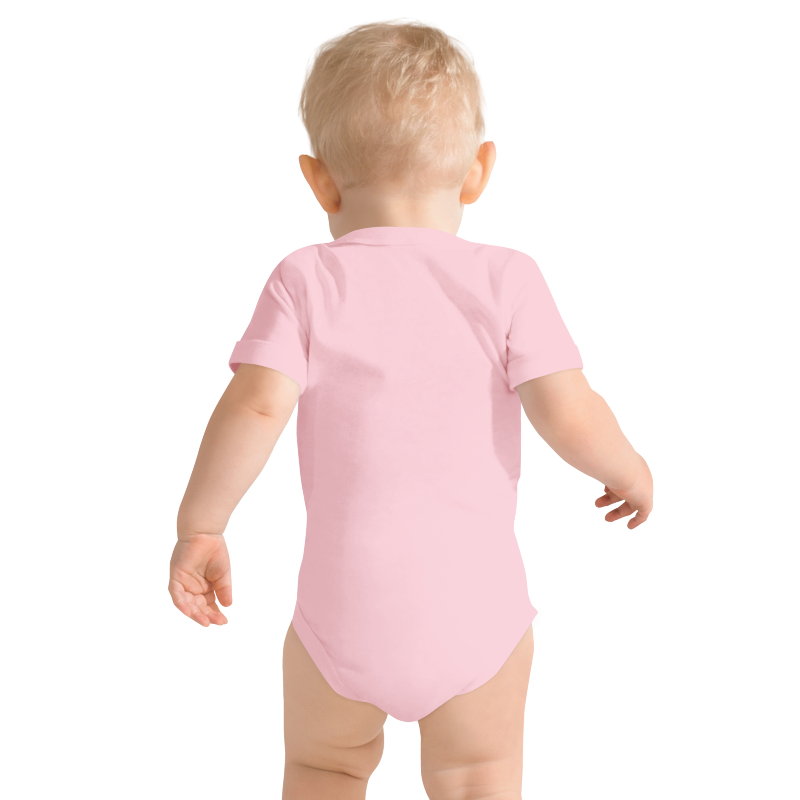 Baby wearing a pink onesie viewed from the back, on plain background, by Less Hustle, More Joy.