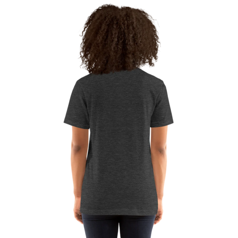 A person shown from the back wearing a dark grey heather t-shirt by Less Hustle, More Joy, with the words 'PLANT LOVER' printed on the front in white text.