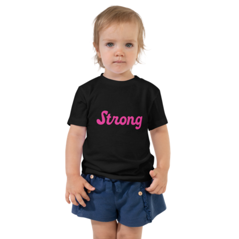 Front view of a black, short-sleeved toddler tee by Less Hustle, More Joy. The front features the word 'Strong' printed in punk rock pink text.