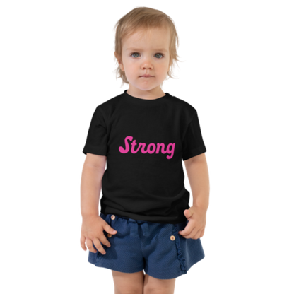 Front view of a black, short-sleeved toddler tee by Less Hustle, More Joy. The front features the word 'Strong' printed in punk rock pink text.