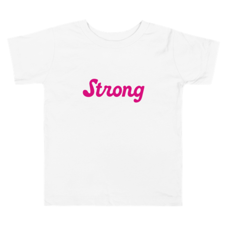 Image of a white, short-sleeved toddler tee by Less Hustle, More Joy. The front features the word 'Strong' printed in punk rock pink text.