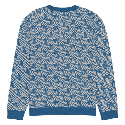 A lay-flat image of the back of a 2XL size crew-neck knitted sweater with a wave pattern in blue and sand colours by Less Hustle, More Joy.